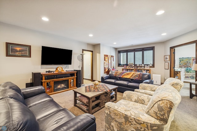 living area featuring carpet floors and recessed lighting