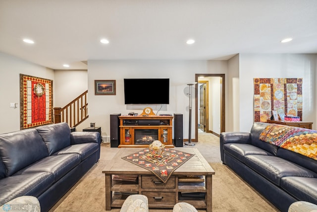 living area featuring light carpet, recessed lighting, stairway, and baseboards