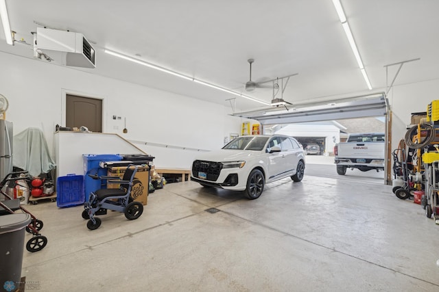 garage featuring ceiling fan and a garage door opener