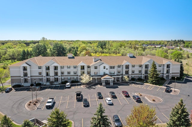 610 Whiskey Rd NW Unit 115, Isanti, MN 55040 - drone / aerial view of a heavily wooded area
