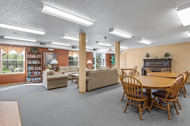 610 Whiskey Rd NW Unit 115, Isanti, MN 55040 - dining space featuring a textured ceiling and carpet