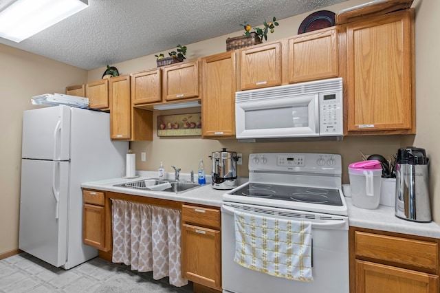 610 Whiskey Rd NW Unit 115, Isanti, MN 55040 - kitchen featuring white appliances, light countertops, and a textured ceiling