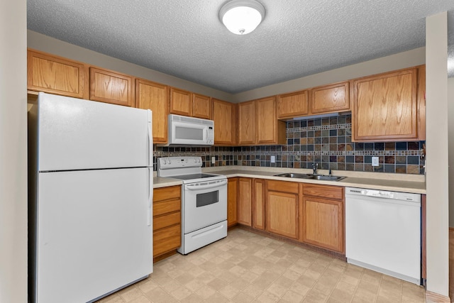 610 Whiskey Rd NW Unit 115, Isanti, MN 55040 - kitchen with white appliances, light countertops, tasteful backsplash, a textured ceiling, and light floors