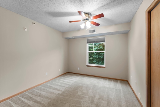 610 Whiskey Rd NW Unit 115, Isanti, MN 55040 - carpeted spare room featuring a ceiling fan and a textured ceiling