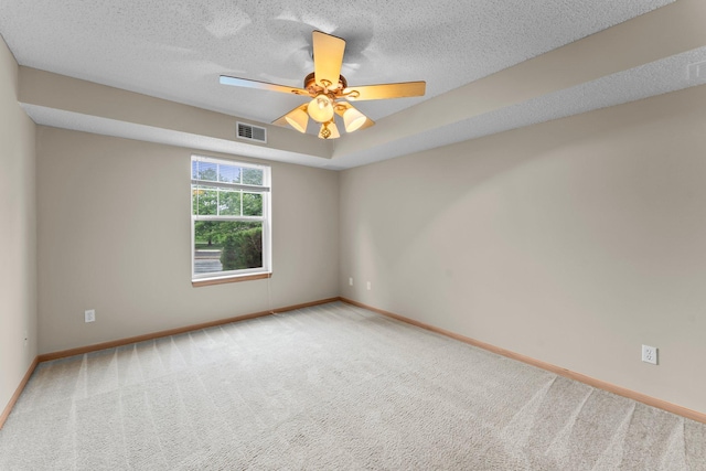 610 Whiskey Rd NW Unit 115, Isanti, MN 55040 - empty room with carpet, ceiling fan, and a textured ceiling