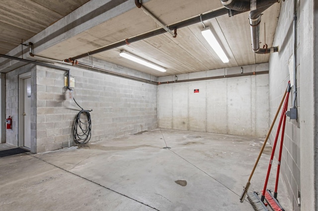 610 Whiskey Rd NW Unit 115, Isanti, MN 55040 - garage featuring concrete block wall