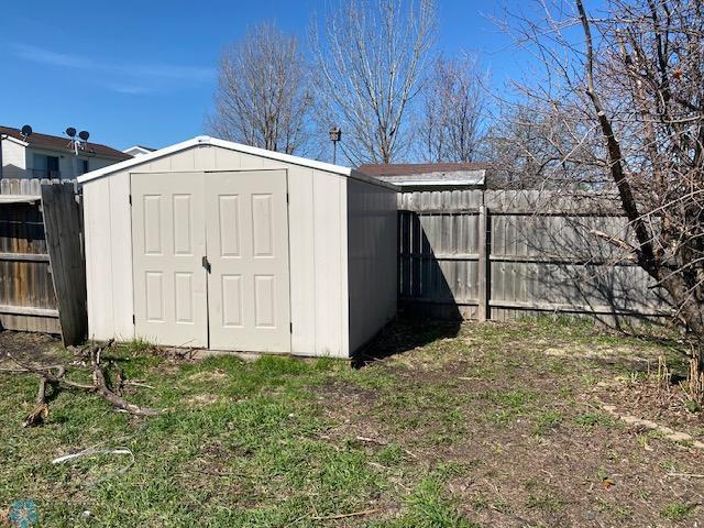 view of shed featuring a fenced backyard
