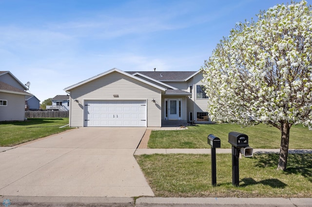 1683 Oakwood Dr, West Fargo, ND 58078 - tri-level home featuring an attached garage and concrete driveway
