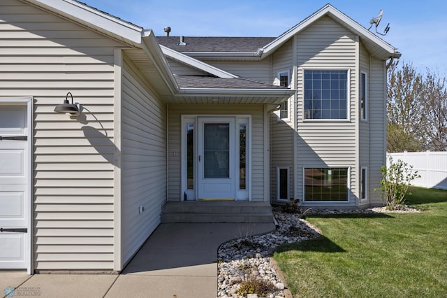 1683 Oakwood Dr, West Fargo, ND 58078 - view of exterior entry featuring roof with shingles and a garage
