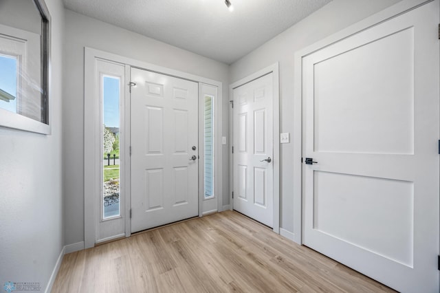 1683 Oakwood Dr, West Fargo, ND 58078 - foyer entrance with light wood-style flooring and baseboards