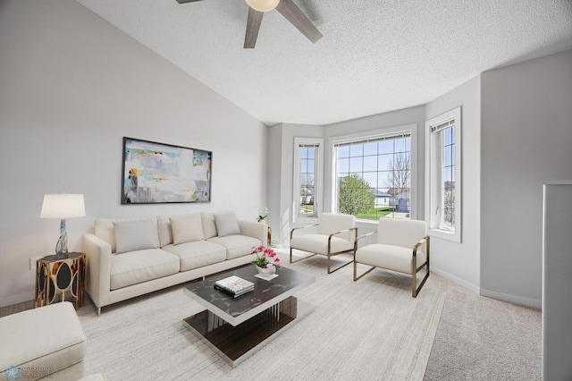 1683 Oakwood Dr, West Fargo, ND 58078 - carpeted living room with a textured ceiling, a ceiling fan, and baseboards