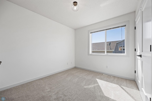 1683 Oakwood Dr, West Fargo, ND 58078 - spare room featuring light carpet and baseboards