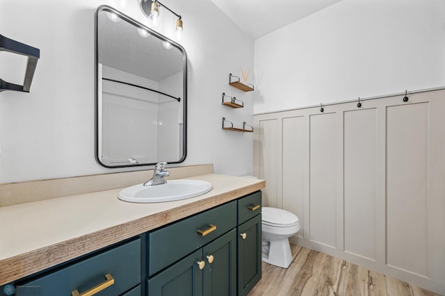 1683 Oakwood Dr, West Fargo, ND 58078 - full bathroom featuring toilet, wood finished floors, and vanity