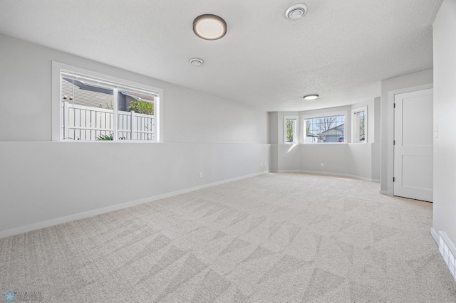 1683 Oakwood Dr, West Fargo, ND 58078 - carpeted empty room with a textured ceiling and baseboards