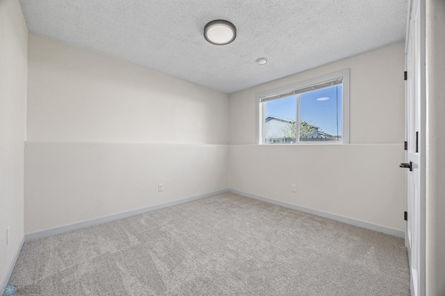 1683 Oakwood Dr, West Fargo, ND 58078 - empty room with carpet floors, a textured ceiling, and baseboards