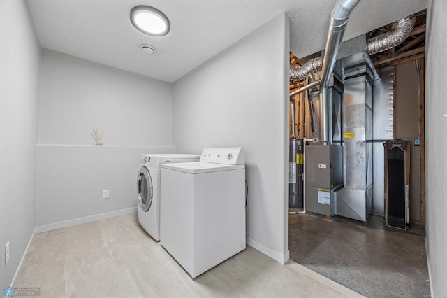 1683 Oakwood Dr, West Fargo, ND 58078 - laundry area with separate washer and dryer, heating unit, water heater, and baseboards