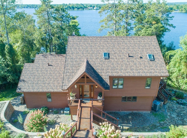 birds eye view of property with a water view