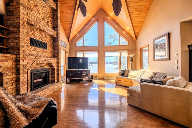 living area with wooden ceiling, high vaulted ceiling, and plenty of natural light