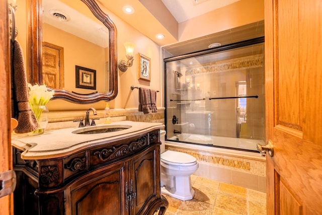 bathroom featuring toilet, vanity, visible vents, recessed lighting, and tiled shower / bath