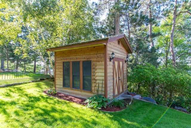 view of shed with fence