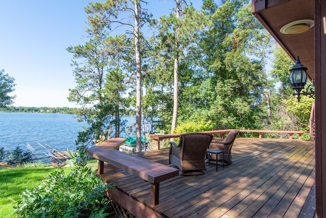wooden deck with a water view