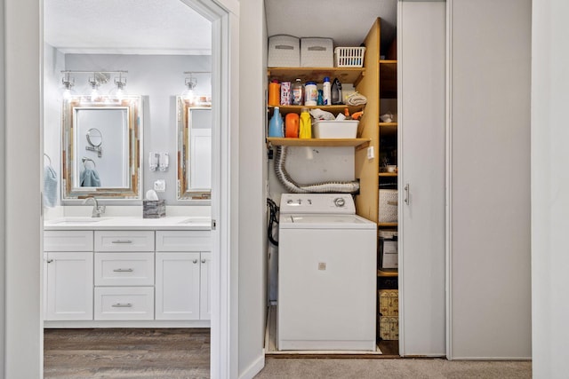 washroom with washer / clothes dryer and wood finished floors