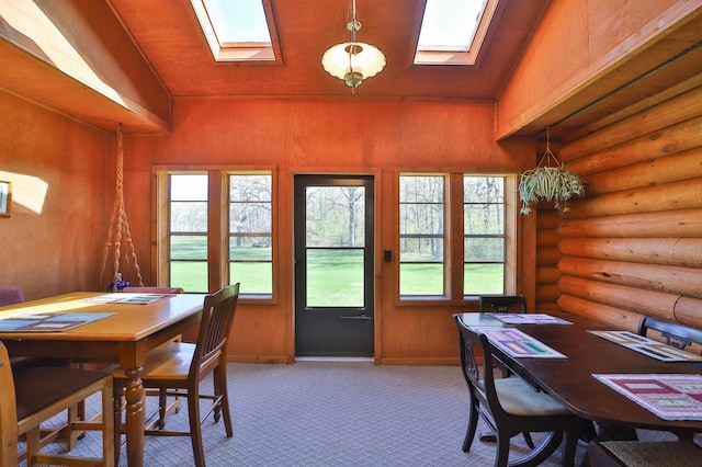 24997 145th Ave, Fort Ripley, MN 56449 - dining room with a skylight, log walls, plenty of natural light, and carpet
