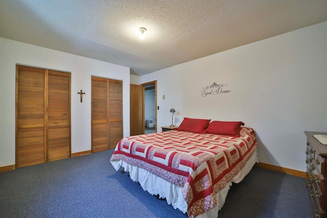 24997 145th Ave, Fort Ripley, MN 56449 - carpeted bedroom featuring multiple closets, baseboards, and a textured ceiling