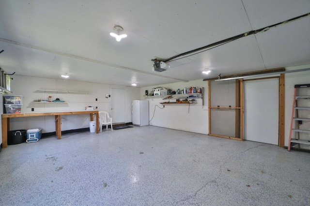 24997 145th Ave, Fort Ripley, MN 56449 - garage featuring a garage door opener and a workshop area