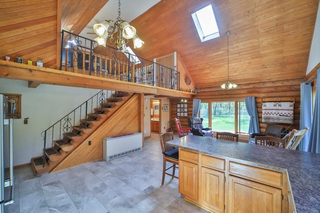24997 145th Ave, Fort Ripley, MN 56449 - kitchen with high vaulted ceiling, a chandelier, open floor plan, a skylight, and pendant lighting