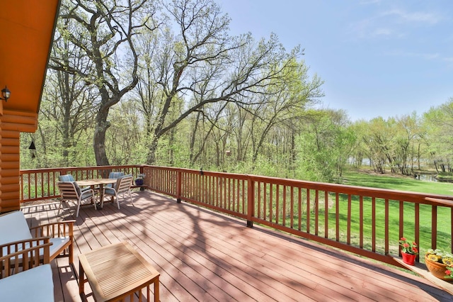 24997 145th Ave, Fort Ripley, MN 56449 - wooden terrace featuring outdoor dining space and a yard