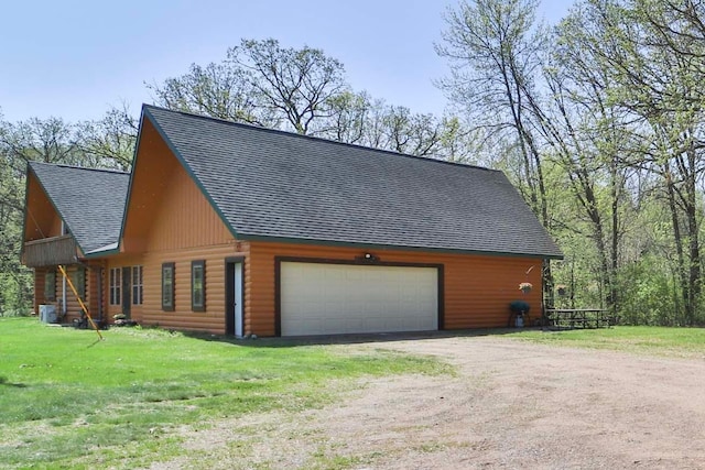 24997 145th Ave, Fort Ripley, MN 56449 - view of side of property featuring a shingled roof, a lawn, and a garage
