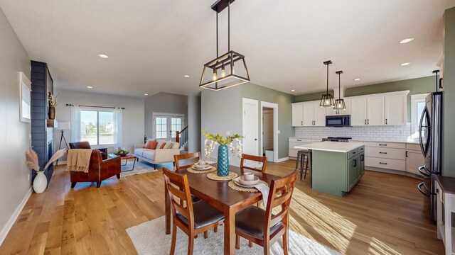 577 Keefe Ct NW, Eyota, MN 55934 - dining room featuring light wood finished floors, recessed lighting, and baseboards