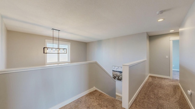 577 Keefe Ct NW, Eyota, MN 55934 - hallway featuring an upstairs landing, carpet floors, recessed lighting, and baseboards