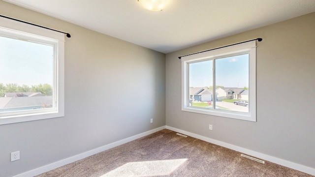 577 Keefe Ct NW, Eyota, MN 55934 - carpeted empty room with baseboards