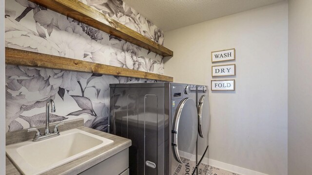 577 Keefe Ct NW, Eyota, MN 55934 - laundry room featuring washer and clothes dryer and baseboards