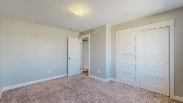 577 Keefe Ct NW, Eyota, MN 55934 - unfurnished bedroom with carpet flooring, a closet, and baseboards