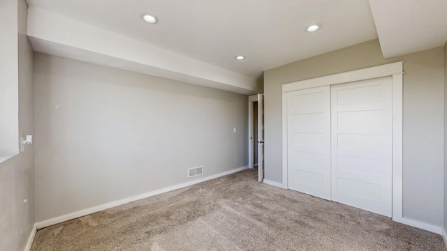 577 Keefe Ct NW, Eyota, MN 55934 - unfurnished bedroom featuring carpet, recessed lighting, baseboards, and a closet