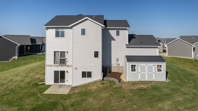577 Keefe Ct NW, Eyota, MN 55934 - back of house with a storage unit, a yard, an outdoor structure, and a patio area