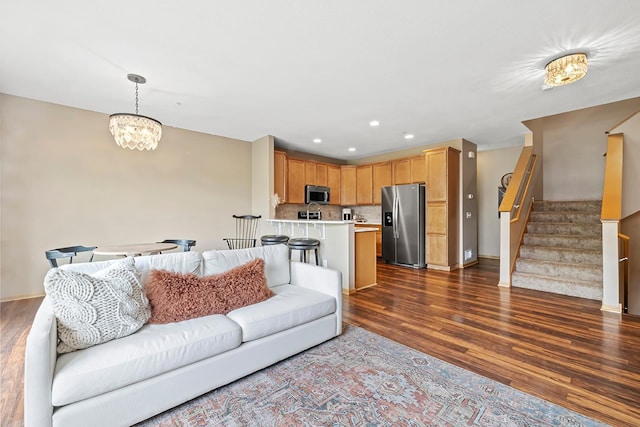 11852 Emery Village Dr N Unit 3302, Champlin, MN 55316 - living area with dark wood-style flooring, stairs, recessed lighting, a chandelier, and baseboards
