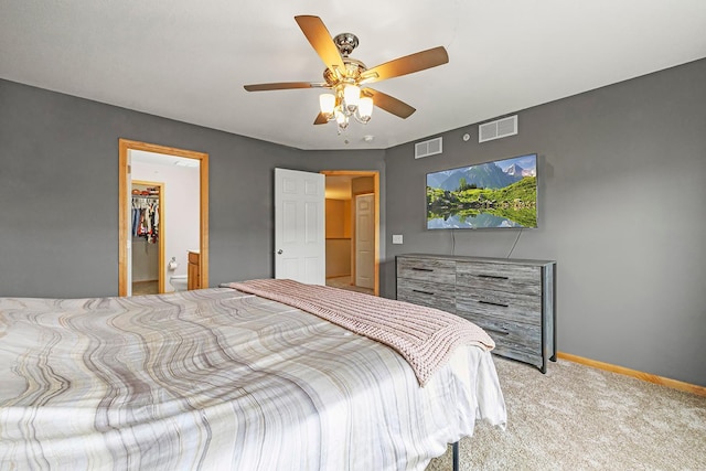 11852 Emery Village Dr N Unit 3302, Champlin, MN 55316 - carpeted bedroom with baseboards, a ceiling fan, and a walk in closet