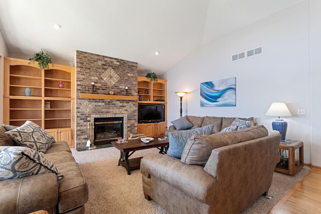 46463 Cambridge Dr, Stanchfield, MN 55080 - living room with a fireplace, lofted ceiling, light wood-style flooring, recessed lighting, and baseboards