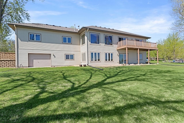 46463 Cambridge Dr, Stanchfield, MN 55080 - back of house featuring a garage, a lawn, and a deck