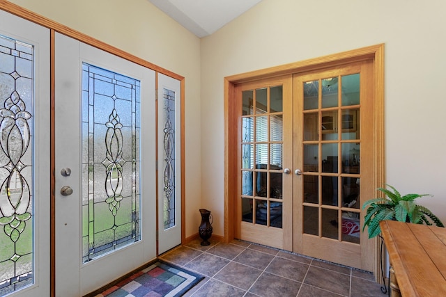 46463 Cambridge Dr, Stanchfield, MN 55080 - entrance foyer featuring french doors, healthy amount of natural light, dark tile patterned flooring, and baseboards