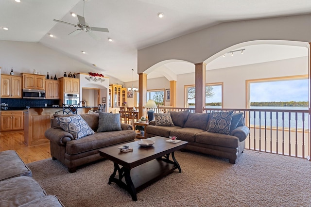46463 Cambridge Dr, Stanchfield, MN 55080 - living area with arched walkways, lofted ceiling, ceiling fan, recessed lighting, and light wood finished floors