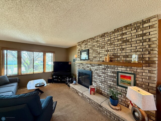 living room with a textured ceiling, a brick fireplace, and carpet floors