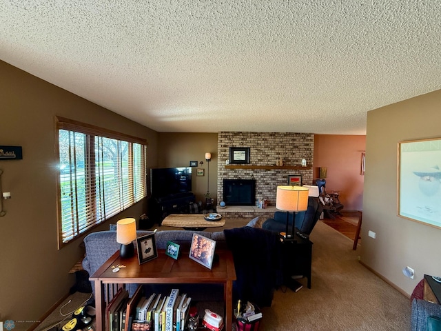 carpeted living area with a fireplace and a textured ceiling