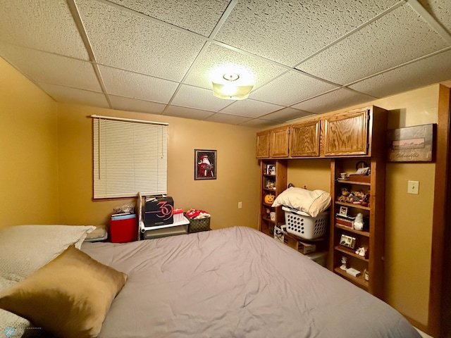 bedroom featuring a drop ceiling