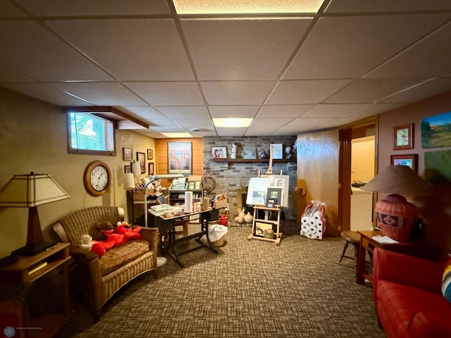 below grade area featuring a paneled ceiling and carpet