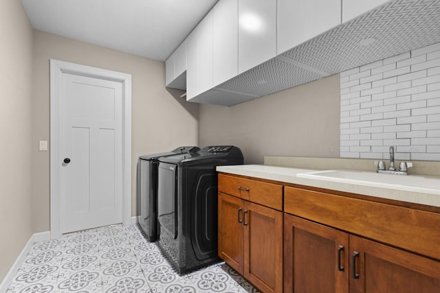 11464 Wagon Wheel Curv, Woodbury, MN 55129 - laundry area with washing machine and clothes dryer, baseboards, and cabinet space